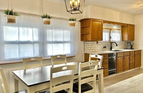 West End House | Comfortable furnishings, central air conditioning, covered patio and outdoor lounge furniture