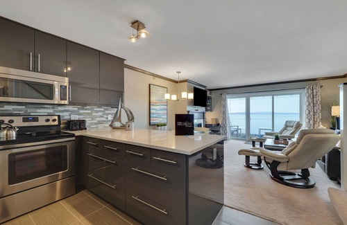 Boyne City Condo | Condo with Lake Charlevoix Views | Private Beach Access | Gas Log Fireplace