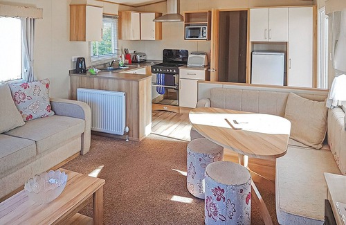Kilcreggan House | Contemporary 12ft-wide caravan with one double and one twin.