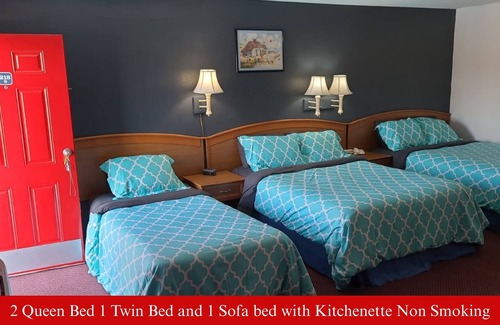 Hutchinson Hotel | Coratel Inn & Suites Hutchinson-2 Queen Bed NS -1 Queen Bed and 1 Full Bed