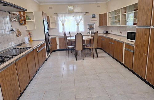 Harare House | Cosy 6 Bedroomed Guest House with a Jet Hot Tub and an Outdoor Swimming Pool