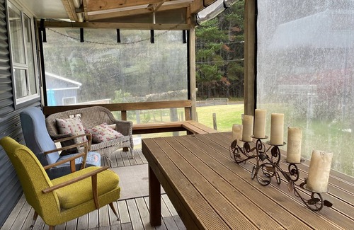 Kawhia Cottage | Cosy Aotea Cottage with water views, a gentle stroll to the beach. Pet Friendly!