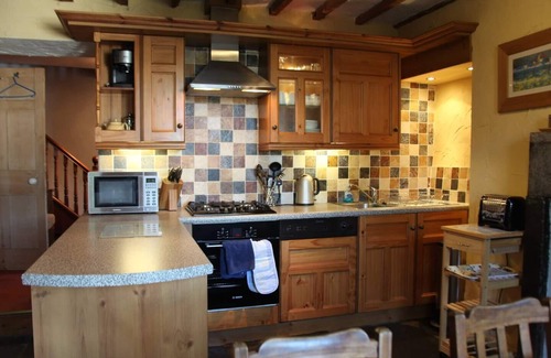 Lindale Cottage | Cosy Lakeland Cottage with jacuzzi bath, log fires and a 4 poster bed.