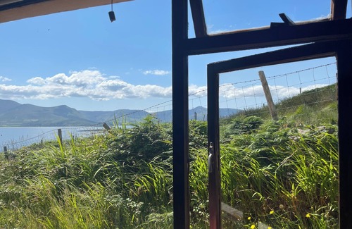 Brandon House | Cottage on Brandon Point on the Dingle Peninsula with sea and mountain views.