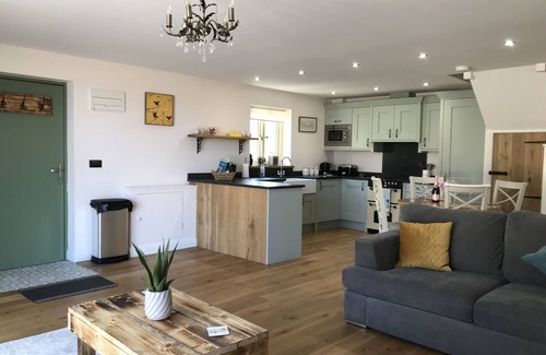 Graigfechan House | Countryside Home with jacuzzi hot tub, open plan living and wood burner.