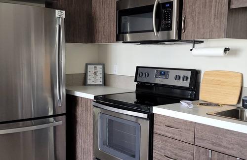 Regina House | COZY 2-BR TOWNHOUSE. Private ATTACHED GARAGE and BALCONY. Near YQR AIRPORT.