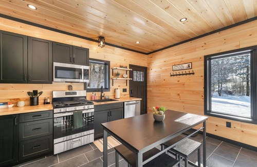 Norwich House | Cozy 2BR/1BA cabin for 6. Fireplace, outdoor fire pit, hot tub, and soaking tub.