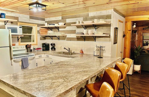 Lansing Township Cabin | Cozy 3-bedroom cabin - sleeps 10- HOT TUB- river viewn