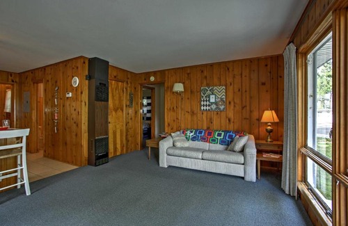 Burt Lake House | Cozy Alanson Cottage - Steps to Dock on Burt Lake!