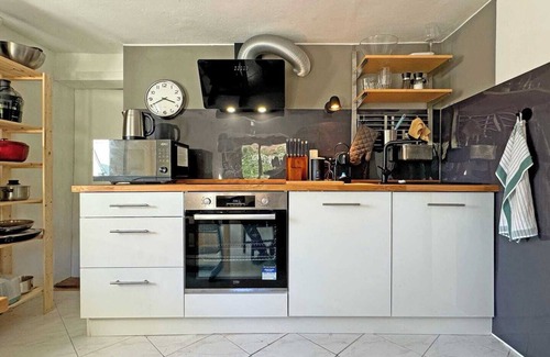 Furstenfeldbruck District House | Cozy Bavarian home with fireplace and fully equipped kitchen.
