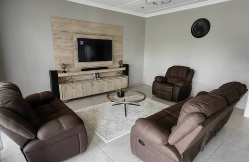 Matsapha House | Cozy bedroom ensuite, fully equipped retreat.