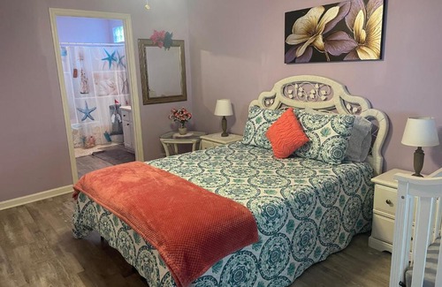 Cedar Grove House | Cozy bedroom with on suite living room