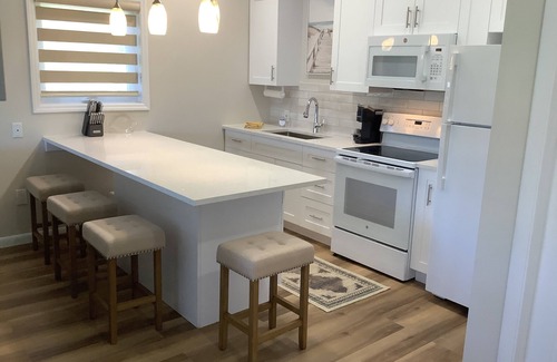 Bahama Reef Apartment | Cozy brand new yellow studio/cottage with free floating dock in Freeport.