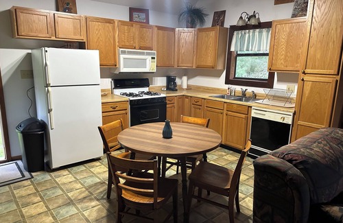 Longleaf Cabin | Cozy Cabin setting behind a 1 1/2 acre pond that is lined with Cypress Trees.