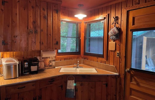 Mio Cabin | Cozy cabin with backyard stream close to Au Sable River and the best ATV trails