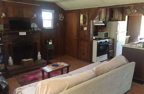 East Falmouth Cottage | Cozy Cape Cod cottage overlooking Jenkins Pond; with private beach & dock.