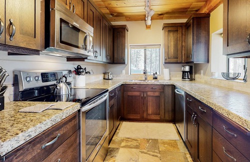 River Forest Acres Cabin | Cozy & colorful retreat with a deck, grill, wood stove, board games, W/D, & AC