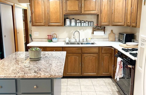 Gobles Cottage | Cozy Cottage Lakefront View - Paddle Board, Kayak, Hot Tub and more!