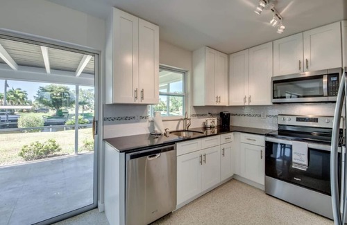 Pelican House | Cozy in the Cape, Heated Saltwater Pool & Gulf access, water view