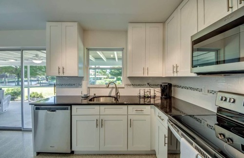 Pelican House | Cozy in the Cape, Heated Saltwater Pool & Gulf access, water view
