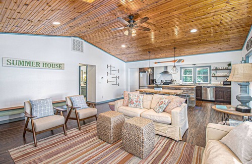 Allegan Cottage | Cozy, lakefront cabin with gas grill and wrap-around deck.
