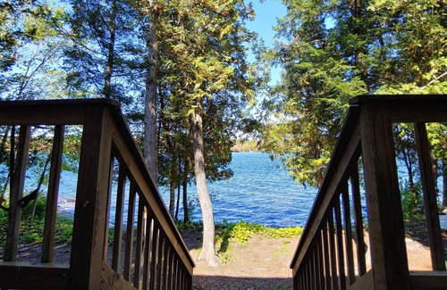 Dexter House | Cozy lakefront home w/ a firepit, outdoor shower, & private beach!