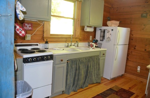 Otto Cabin | Cozy Pet Friendly Mountain Log Cabin in the Smokies with Deck and fire pit.