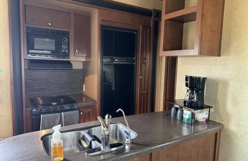 Gilbert House | Cozy RV tucked back in a quiet property with plenty of room to relax