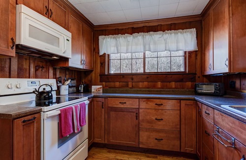 Rosman Cottage | Cozy Stay Near Brevard: Hot Tub & Creek Views