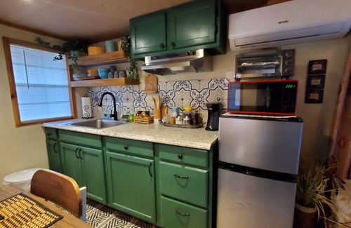 Mead Cabin | Cozy tiny cabin nested in the trees in a lake community, peaceful countryside.