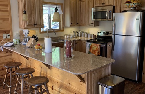 Ponderosa Cabin | Cozy two bedroom cabin with hearty Firewood Stove/Game Room