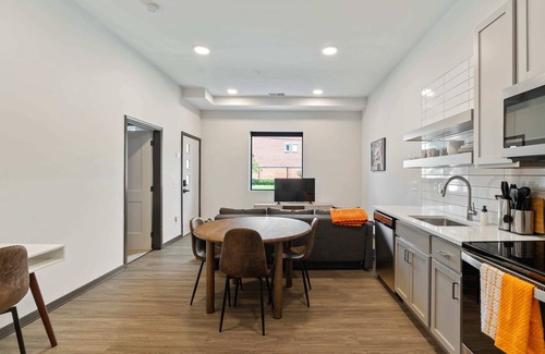 Lockerbie Square Apartment | CozySuites Mass with parking, lounge and roof deck 1
