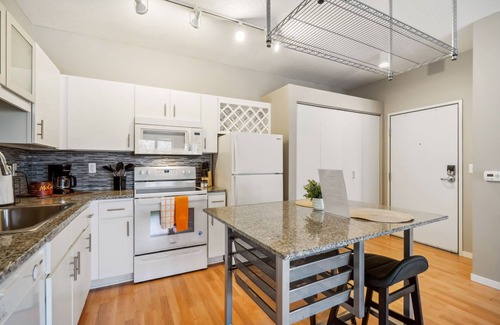 Mill District Apartment | CozySuites Mill District with pool, gym #01