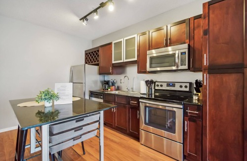 Mill District Apartment | CozySuites Mill District with pool, gym # 10