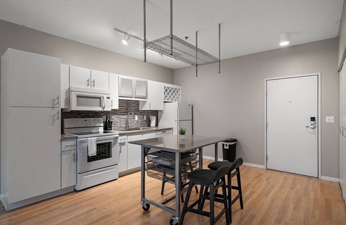 Mill District Apartment | CozySuites Mill District with pool, gym #12