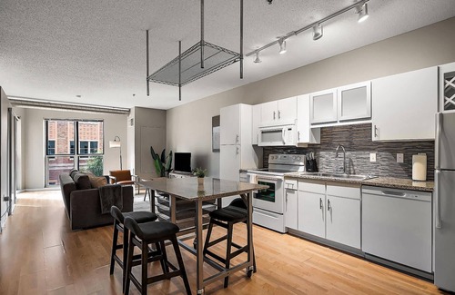 Mill District Apartment | CozySuites Mill District with pool, gym #12