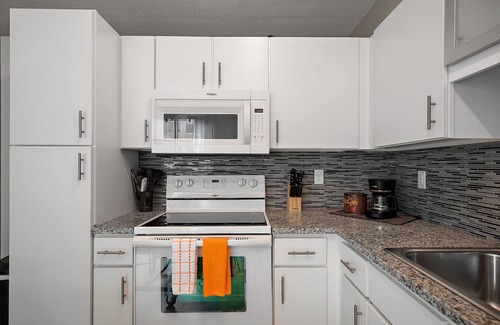 Mill District Apartment | CozySuites Mill District with pool, gym #13