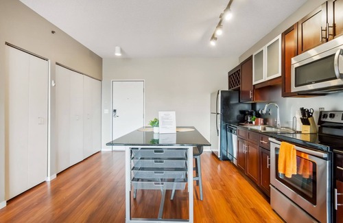 Mill District Apartment | CozySuites Mill District with pool, gym # 09