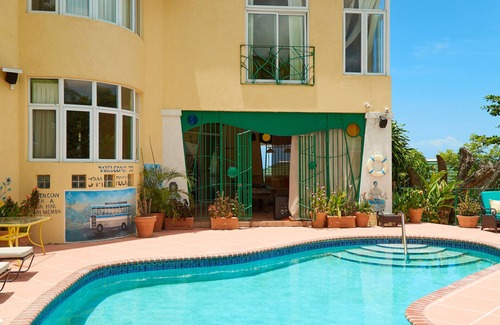 Jack's Hill House | Crowne Gardens. Safe, quiet, luxurious Kingston home with a scenic view.