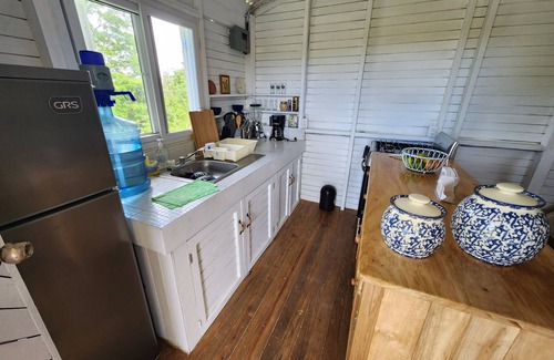 Rio Dulce Cabin | Cute & Cozy Caribbean Cabin on a farm.