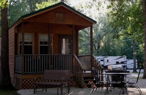 Manchester Cabin | Deluxe Cabin (w/Bathroom) - Deluxe Cabin (w/Bathroom) Better than a motel! Enjoy camping in comfort! Kitchen with stove top and full size fridge with dishes pots included. Full bathroom with shower. Cable TV DVD player. Gas grill on your own concre