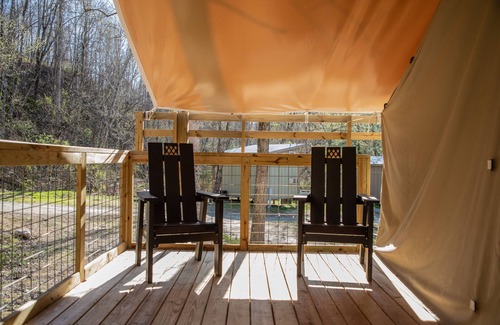 Saluda RV Rental | Deluxe Green River Glamping Tent in nature with wood burning oven!