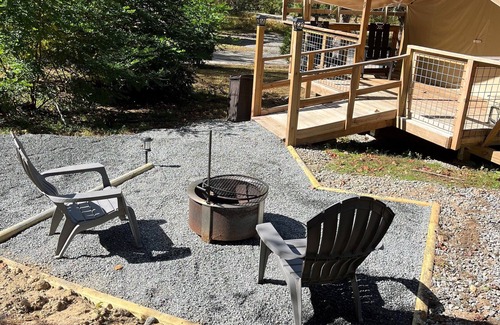 Saluda RV Rental | Deluxe Green River Glamping Tent in nature with wood burning oven!