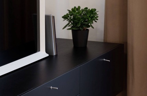 Liberty Avenue Apartment | Design Central Studio Apartment with Balcony by Hostlovers