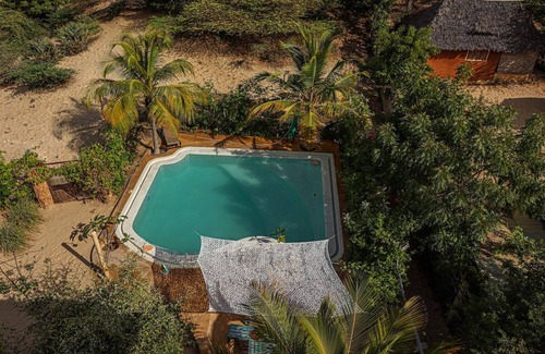 Lamu Villa | Dive in to our pool and feel the breeze at Mbibo House in the Shela sand dunes