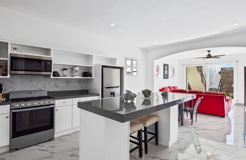 La Paloma House | Dog-friendly home 3 rows to beach with rooftop deck, pool, & kitchen