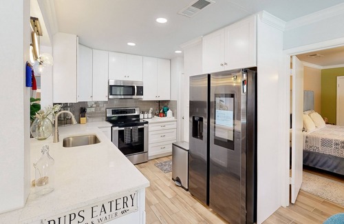 Bedford House | Dog-friendly retreat with oasis yard, amazing pool, tropical bar, & firepit