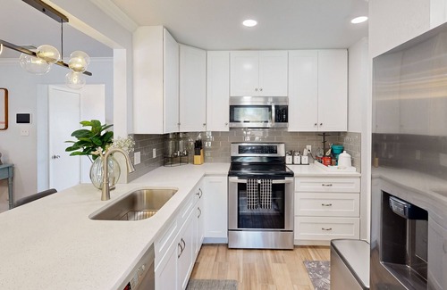 Bedford House | Dog-friendly retreat with oasis yard, amazing pool, tropical bar, & firepit