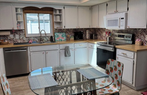 Regency Park House | Dog-Friendly Tropical Getaway with a Covered Pool -Nearby Beaches!