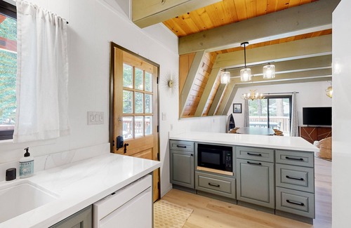 Arnold House | Dog-friendly wilderness retreat with pool, grill, circular fireplace, & W/D